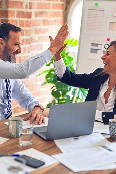 two people connecting by slapping hands