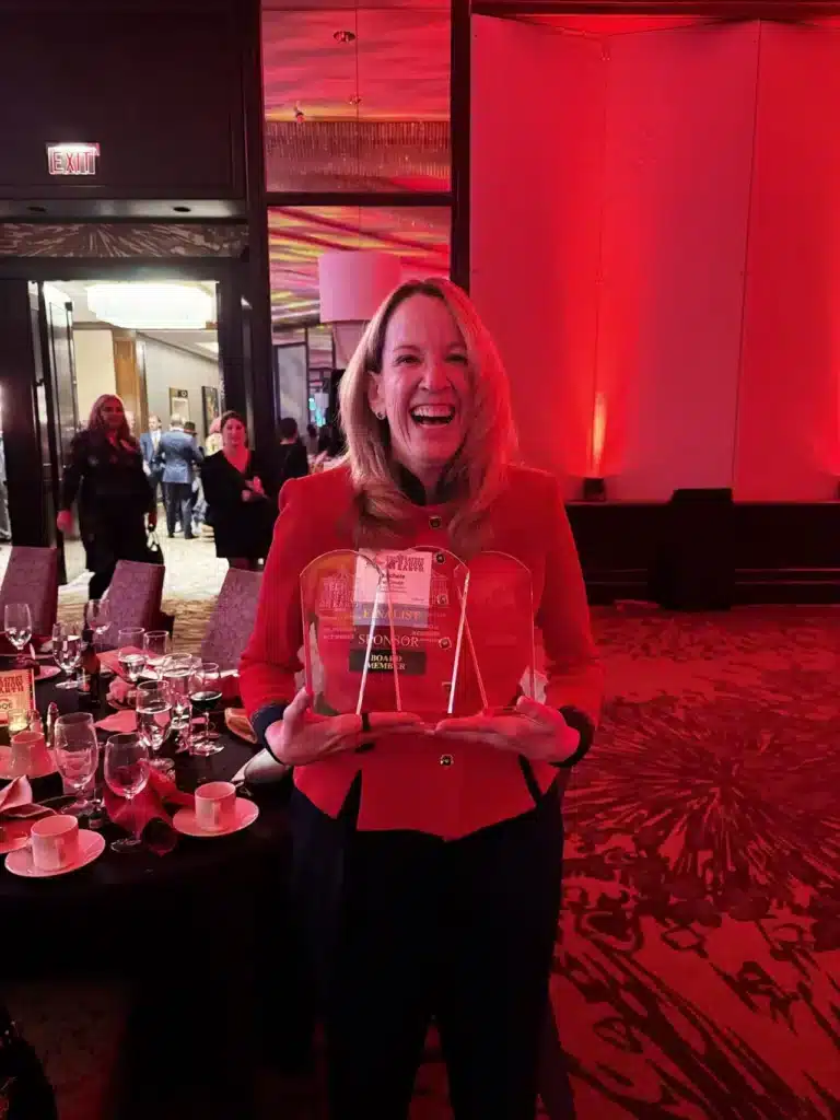 Michele holding s4nets' three awards